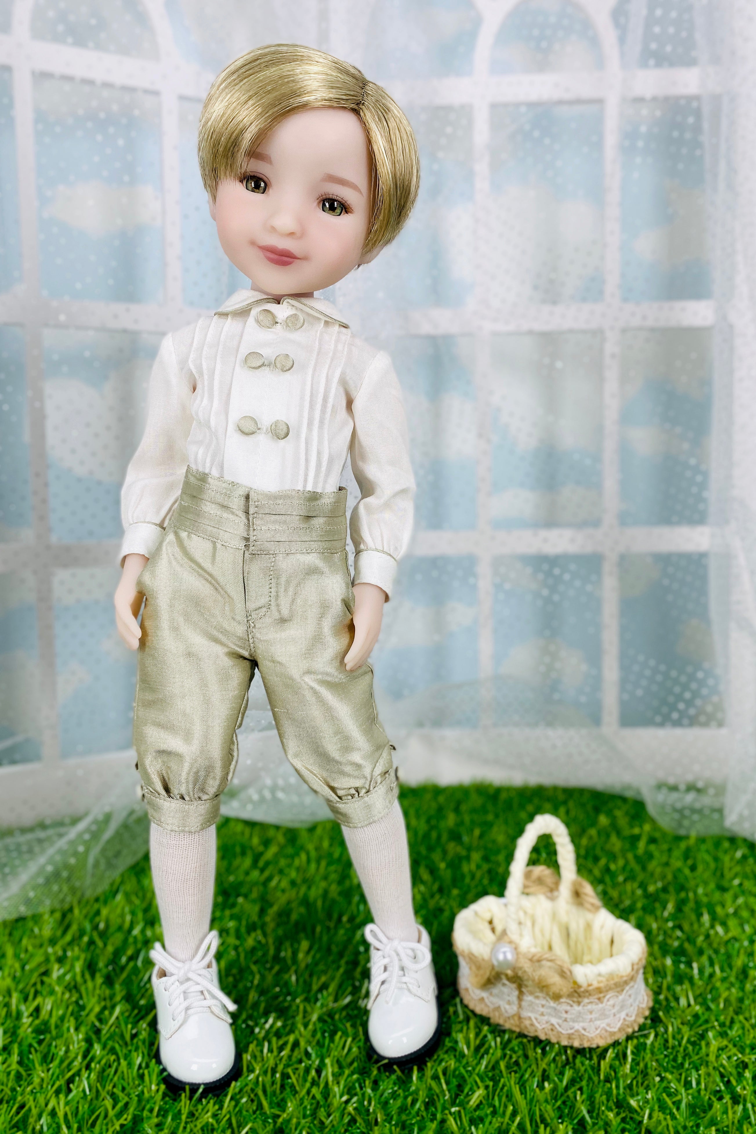 Doll in formal attire with a basket on grass