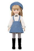 Doll wearing a blue dress with a white shirt and black boots on a white background