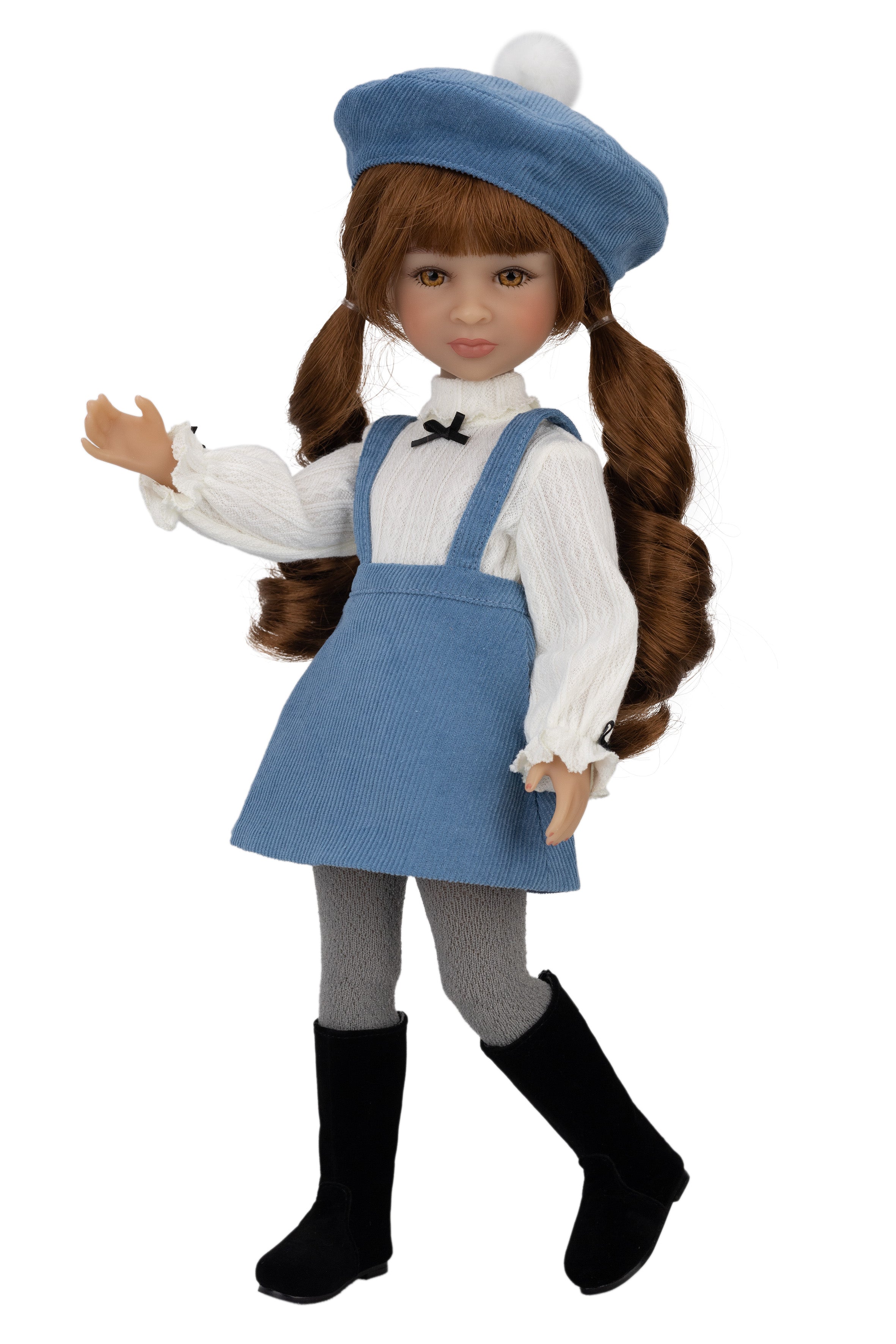 Doll wearing a blue dress with a white shirt and black boots on a white background