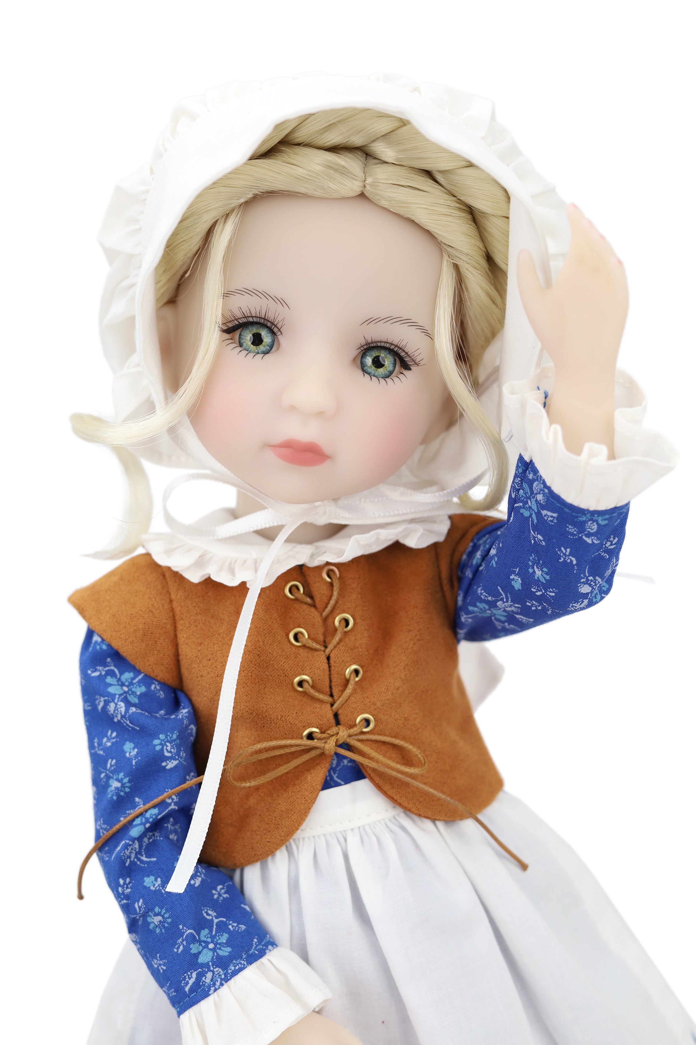 Doll wearing a historical outfit with a brown vest and blue sleeves on a white background