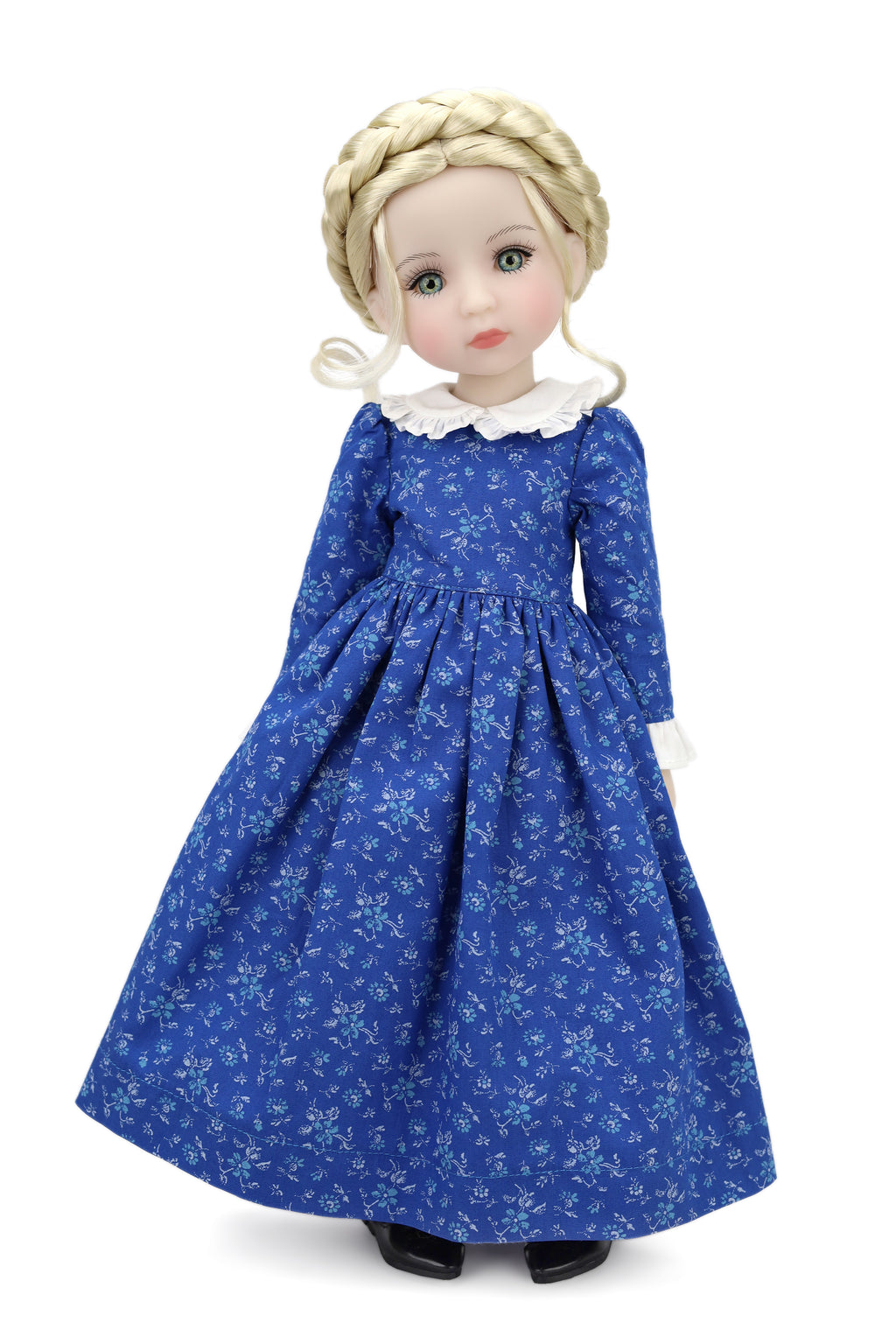 Doll wearing a blue floral dress on a white background