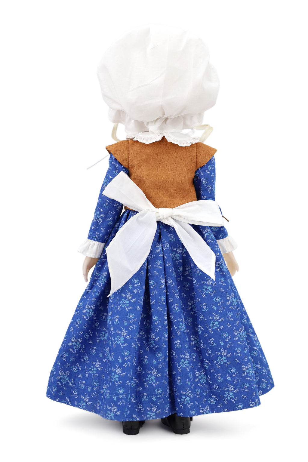 Doll wearing a blue dress with white floral pattern and white bonnet on a white background