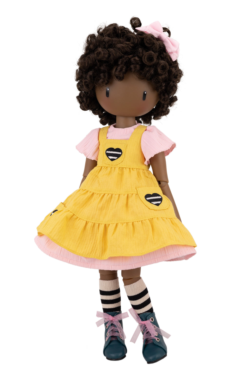 Doll with yellow dress on a white background
