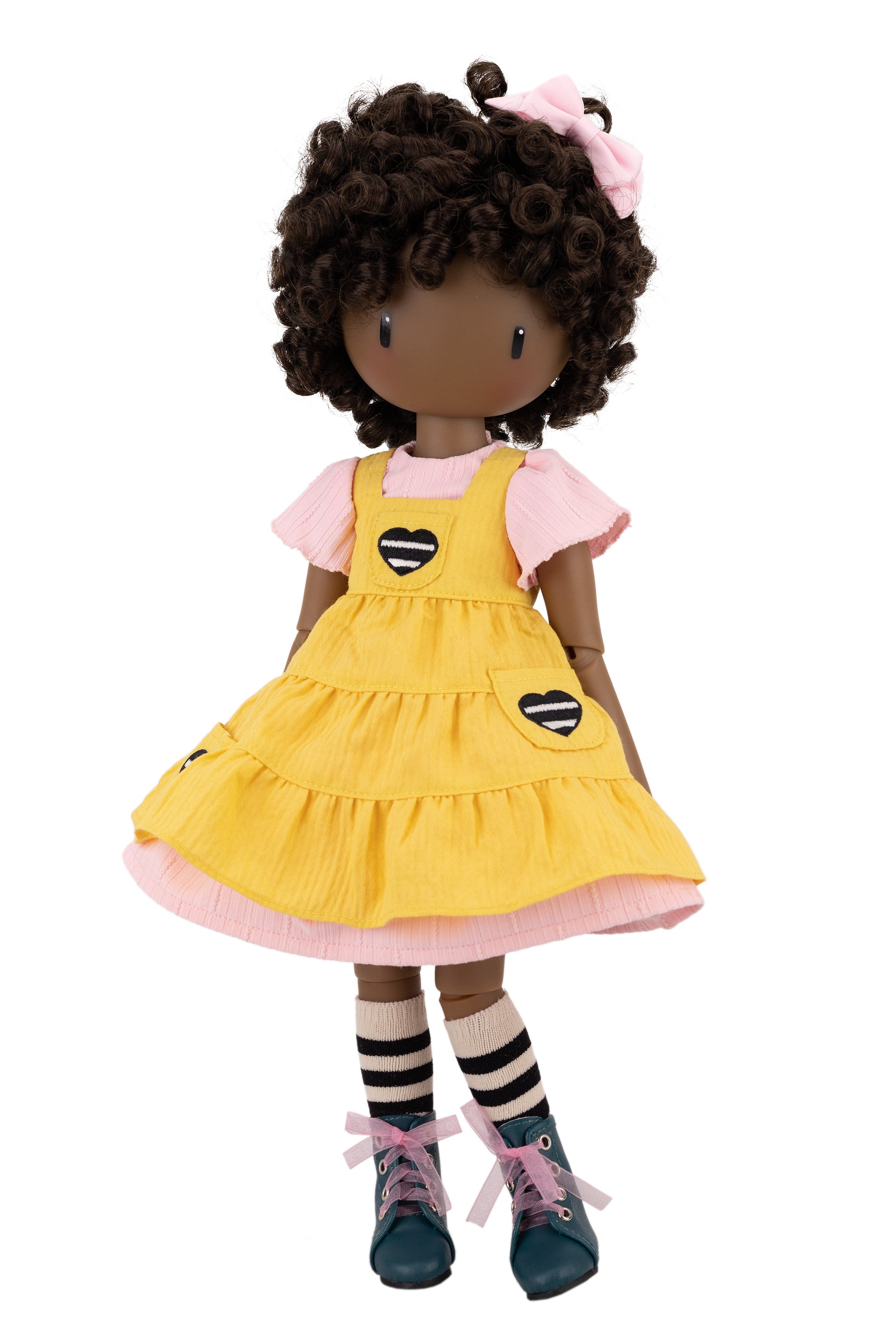 Doll with yellow dress on a white background