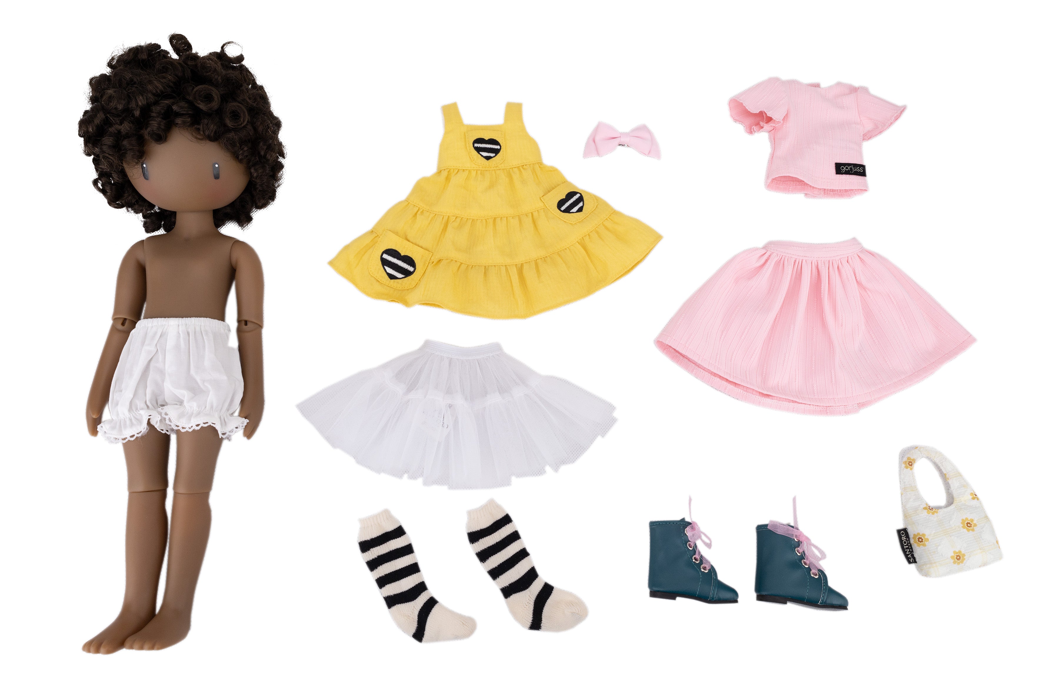 Doll with underpant and accessories including a yellow dress, a pink bow headpiece, pink top, pink skirt, socks, shoes, and a handbag on a white background.