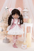 Doll in a pink outfit with bear ears in a decorative setting