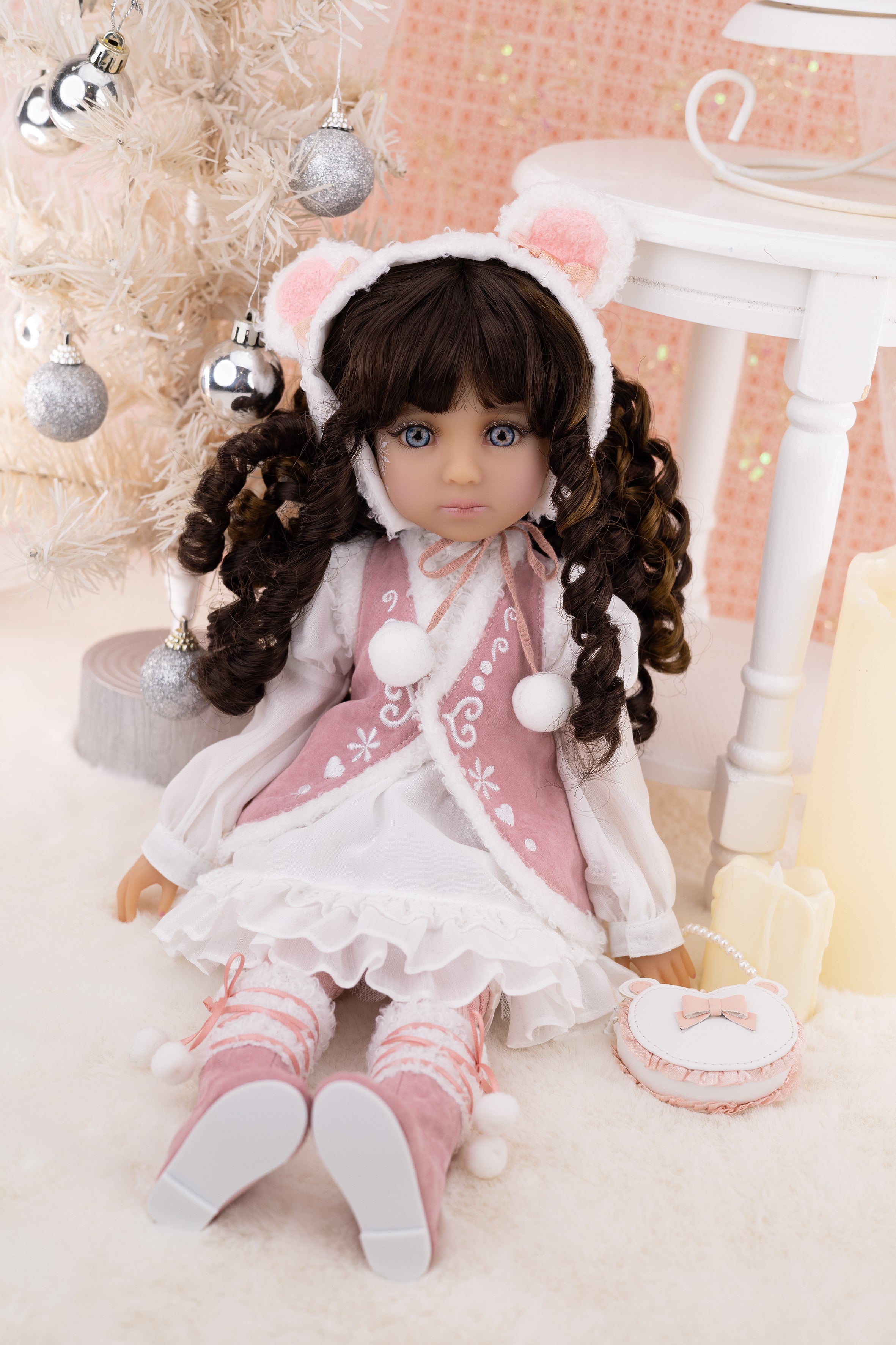 Doll in a festive setting with Christmas decorations