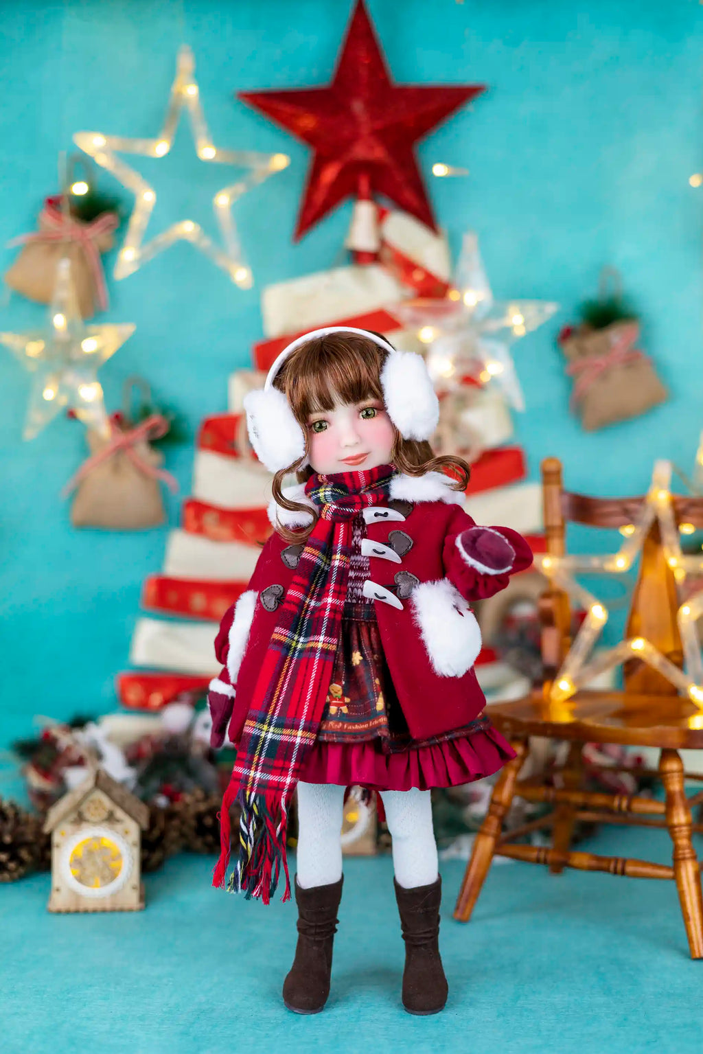 Doll in a festive outfit with a Christmas tree and decorations in the background