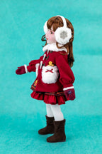 Doll wearing a red outfit with white fur trim on a teal background