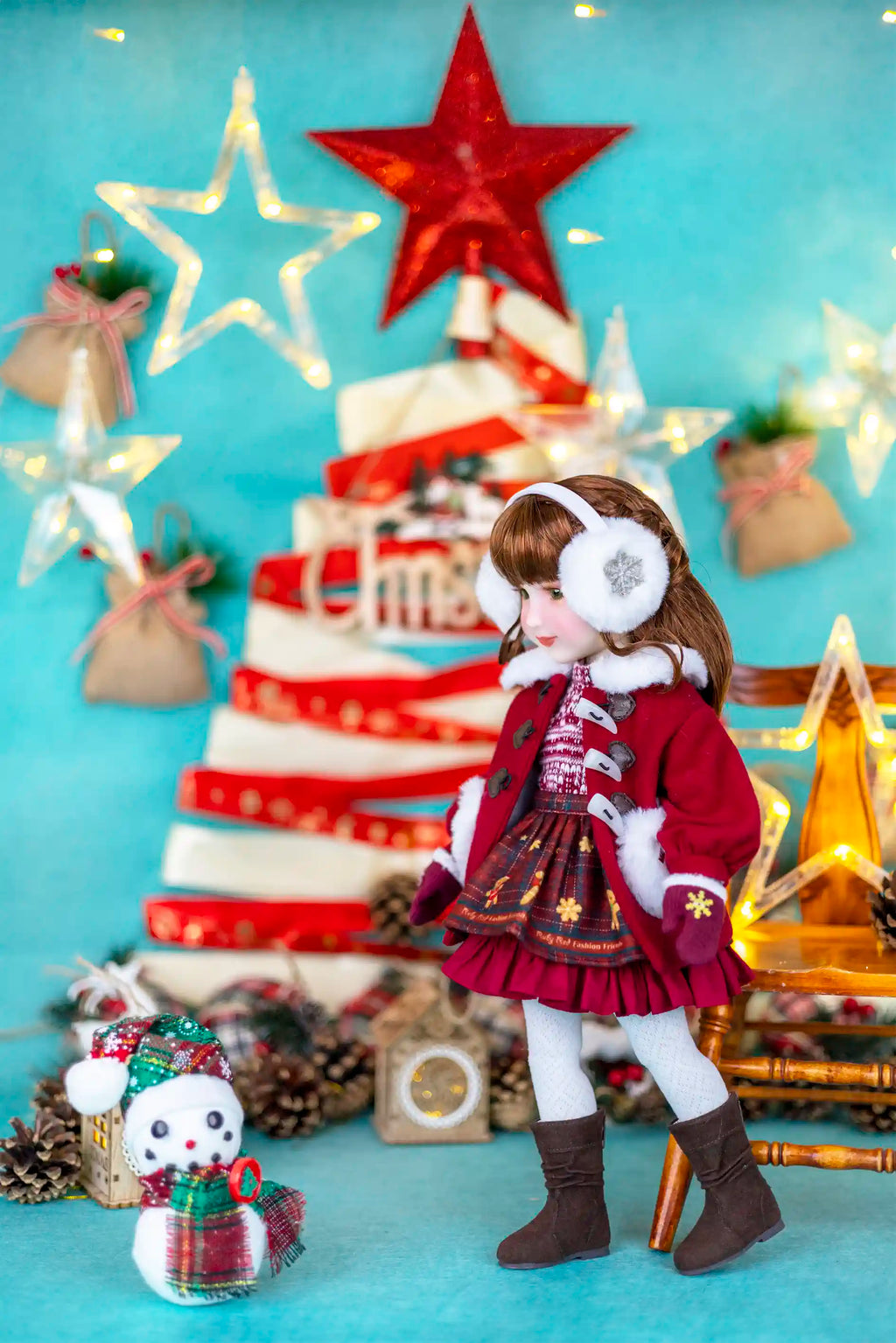 Doll in festive outfit with Christmas tree and decorations