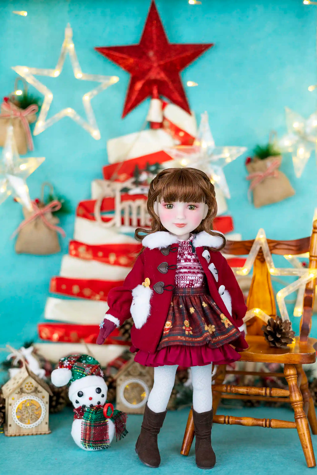 Doll in festive setting with Christmas tree and decorations