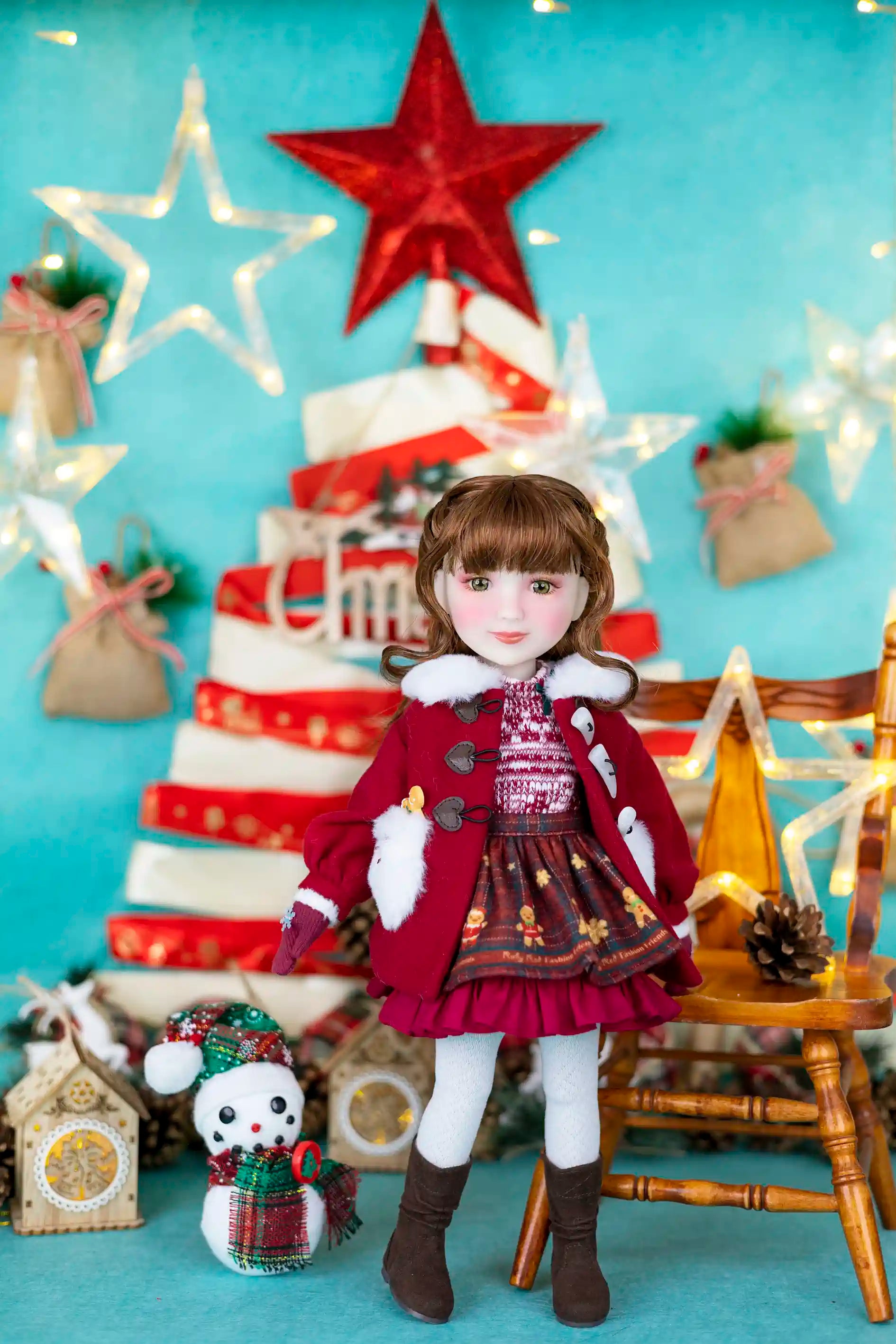 Doll in festive setting with Christmas tree and decorations