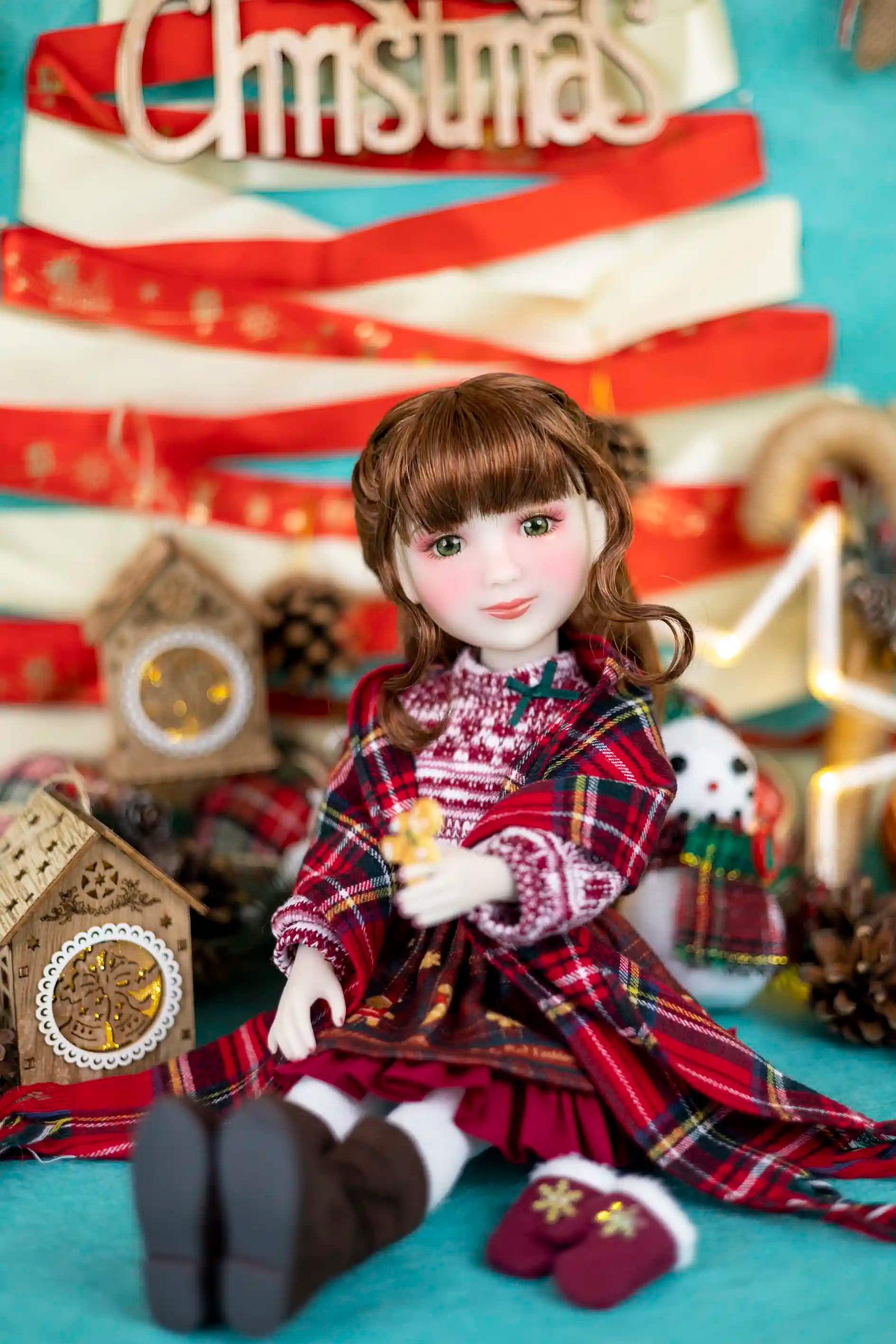 Doll in a festive setting with Christmas decorations