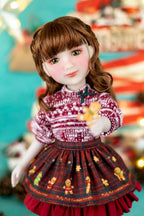 Doll with a patterned dress against a festive background
