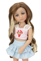 Doll with long brown hair wearing a pink top and blue skirt on a white background