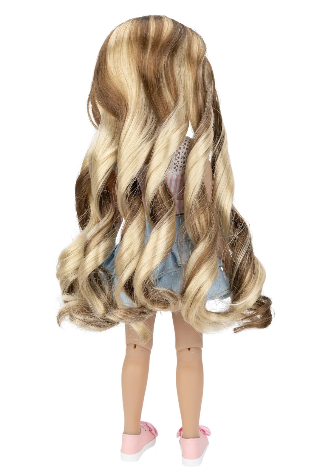 Doll with long, wavy hair on a white background