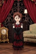 Doll in a red and black dress standing in an ornate room with red curtains and a clock.