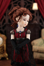 Doll in a vintage outfit with a dark background