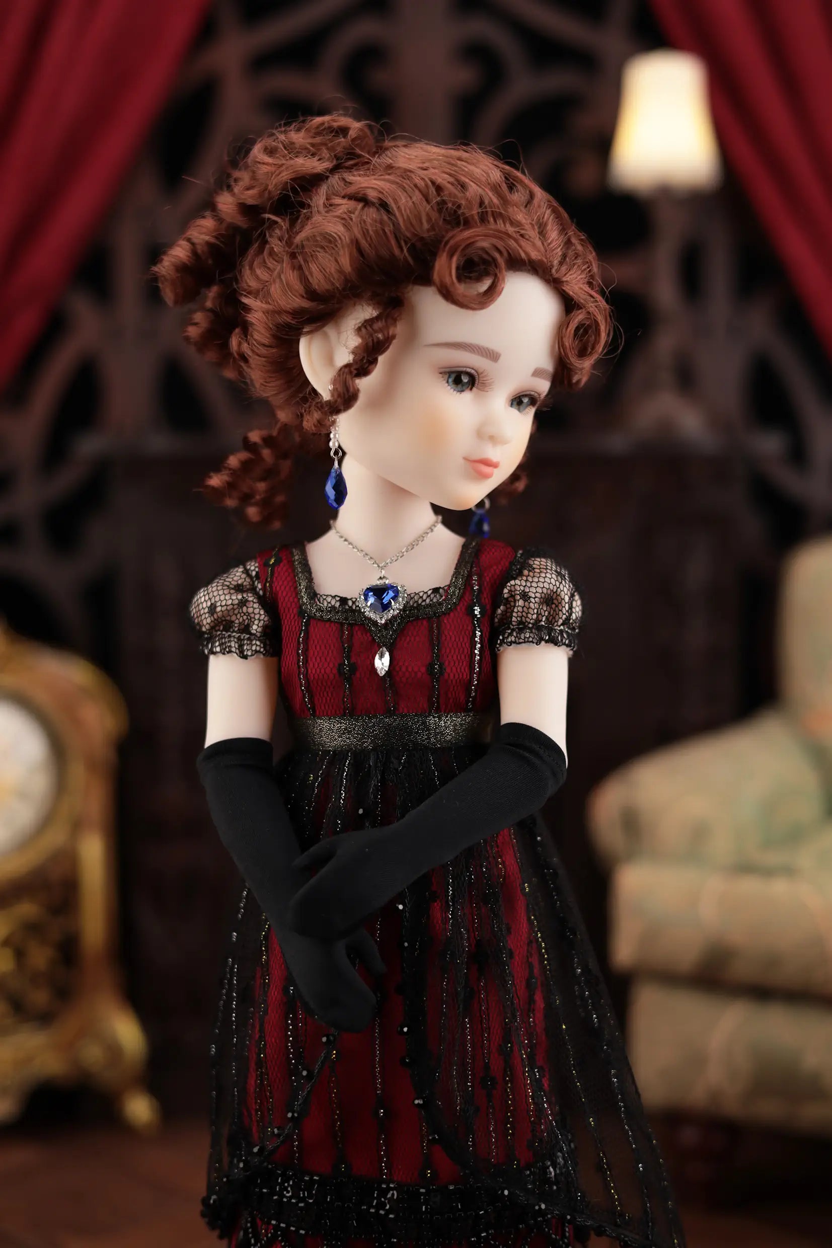 Doll in a vintage outfit with a dark background