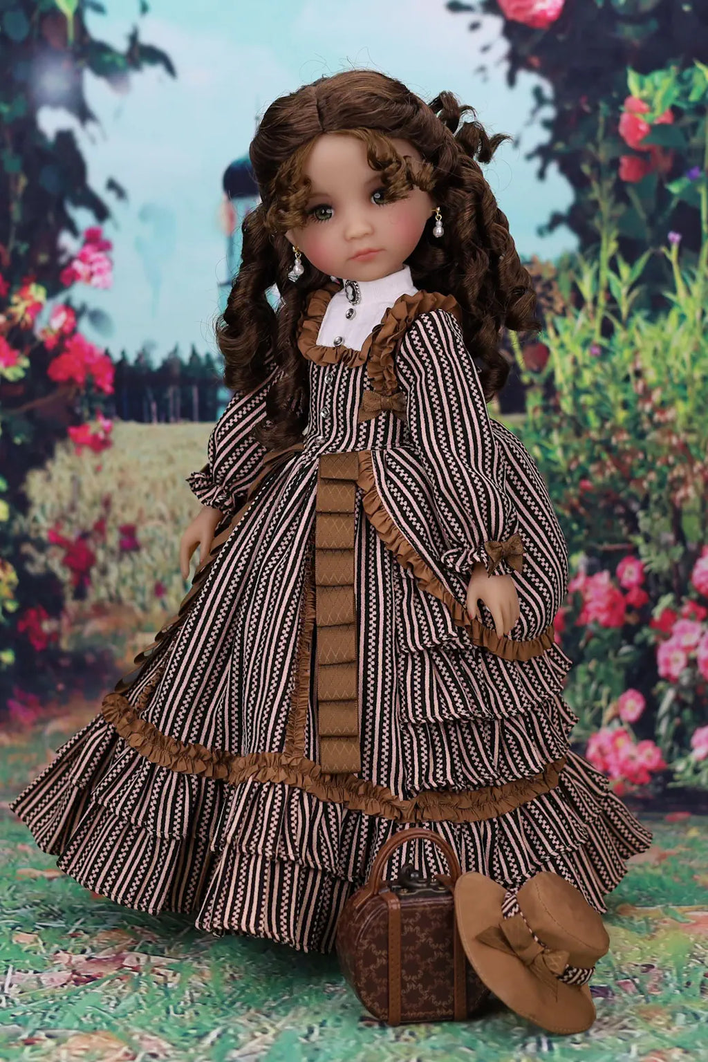 Doll in a detailed dress with a suitcase against a floral background