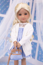 Doll wearing a white cardigan over a blue dress with a matching handbag against a light blue background.