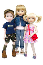 Three dolls dressed in casual clothing on a white background