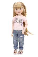 Doll wearing a pink shirt with text and blue jeans on a white background