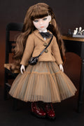 Doll in a brown outfit with a black handbag on a dark background