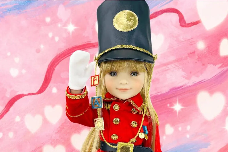 Doll in a red uniform with a black hat on a pink heart-patterned background