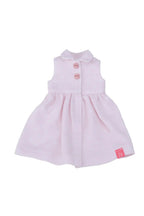 Pink dress with buttons on a white background