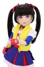 Doll with long black hair styled in pigtails, wearing a colorful outfit with a yellow vest, blue skirt on a white background.