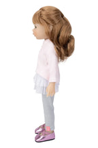 Doll with blonde hair, light pink top, silver leggings, and pink shoes on a white background