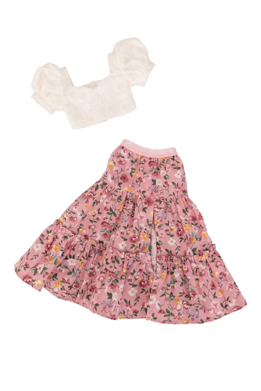 Pink floral skirt with white top on a white background