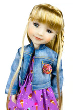 Doll with blonde hair, denim jacket, and purple dress with ice cream pattern on a white background