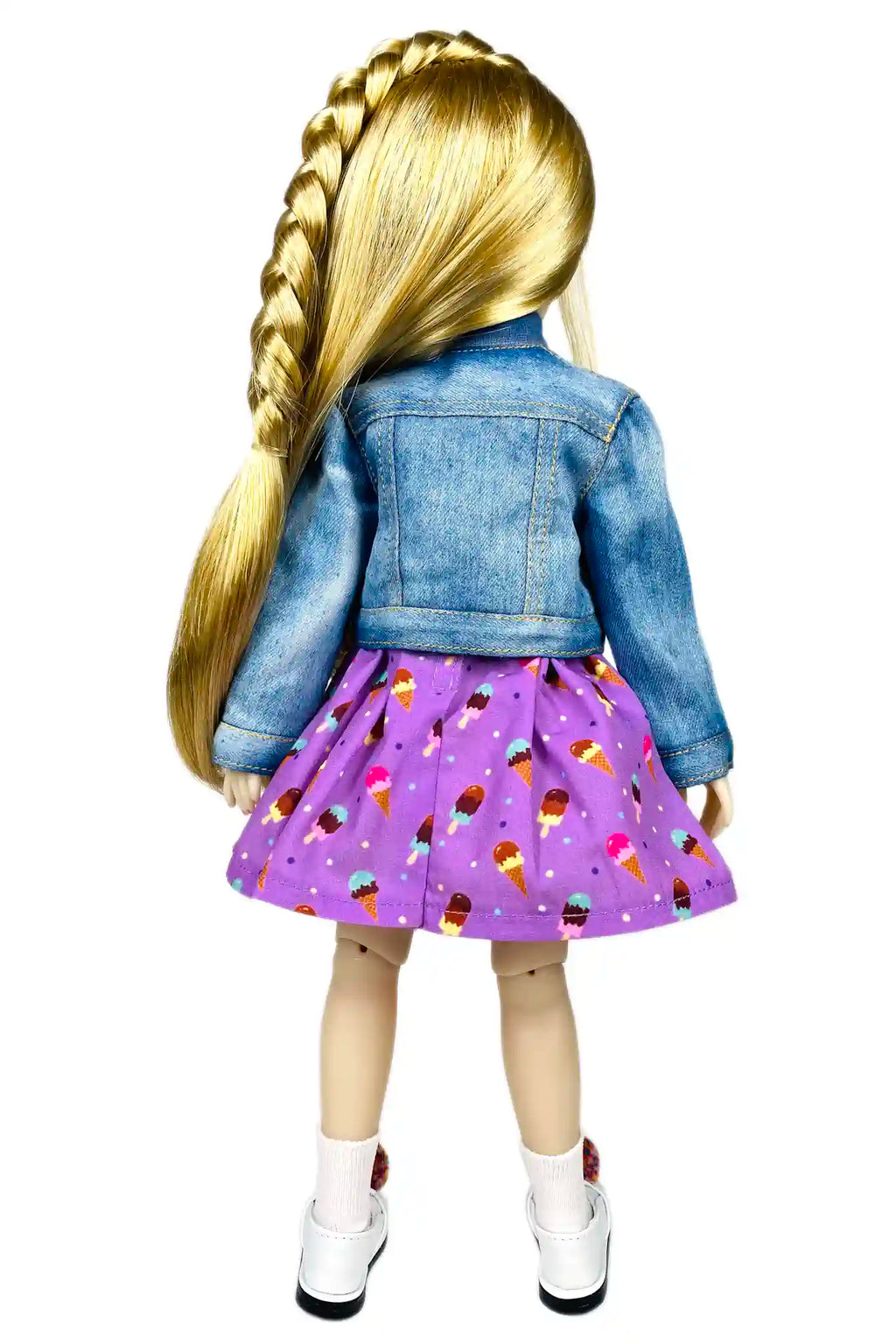 Doll wearing a denim jacket and purple skirt with ice cream pattern on a white background