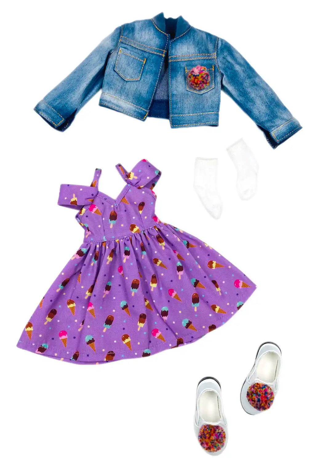 Ruby Red Fashion Friends dolls' denim jacket, purple dress with ice cream pattern, and white shoes on a white background