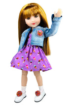 Doll wearing a denim jacket and purple dress with ice cream pattern on a white background