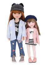Stella and Sunny wearing stylish outfits with jackets and hats on a white background