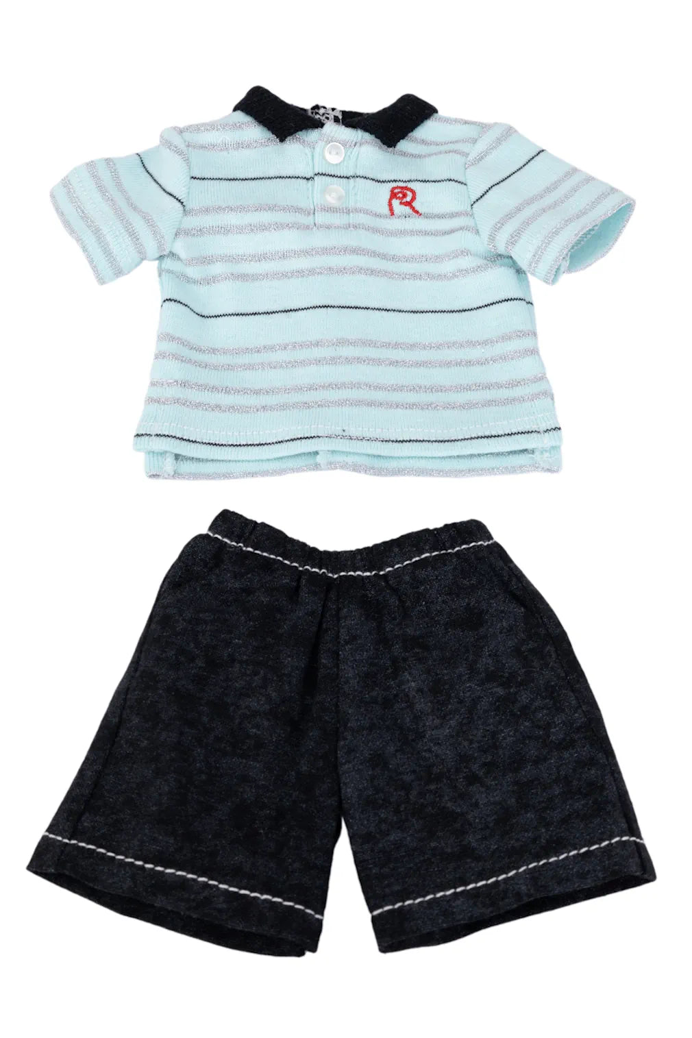 Doll's outfit with striped shirt and black shorts on a white background