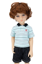 Doll with brown hair wearing a striped shirt and shorts on a white background