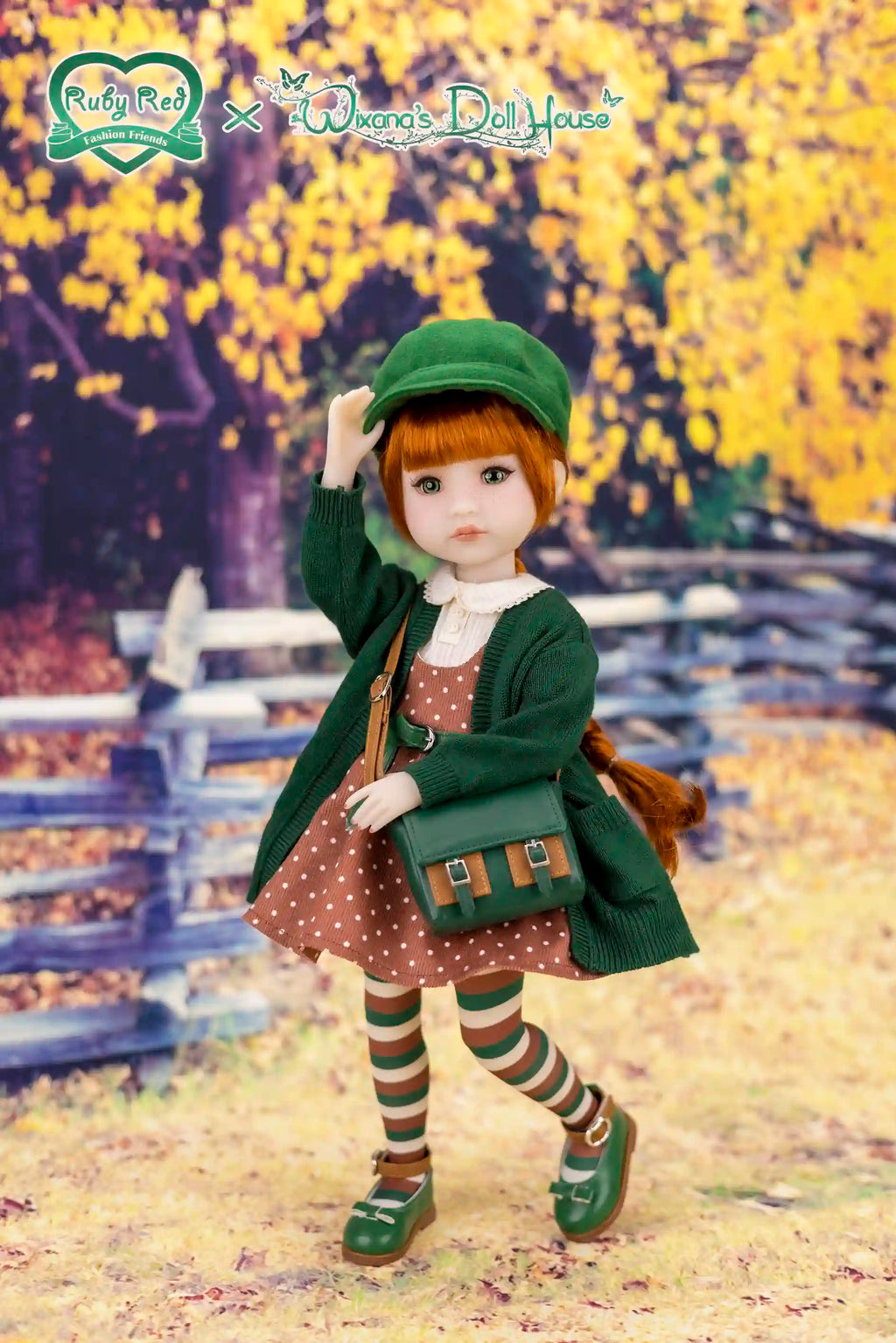 Doll in a green outfit with a polka dot dress, standing outdoors with autumn foliage.