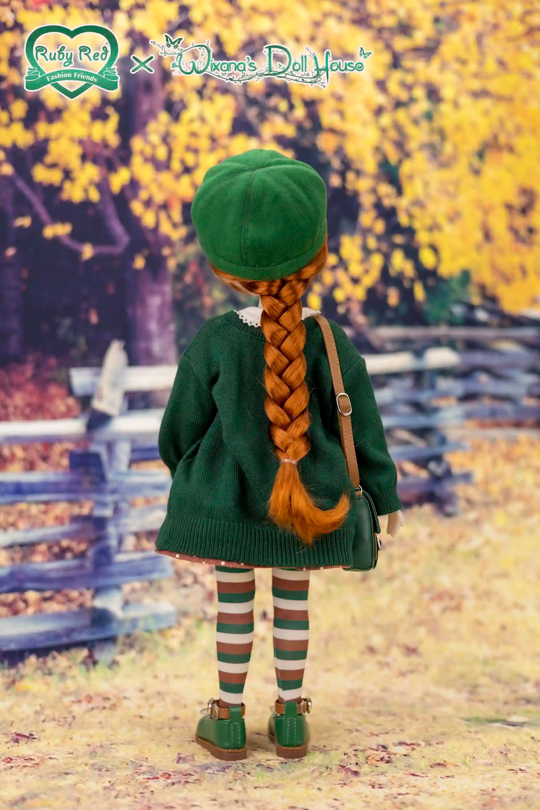 Doll in green outfit with braided hair standing in a forest setting