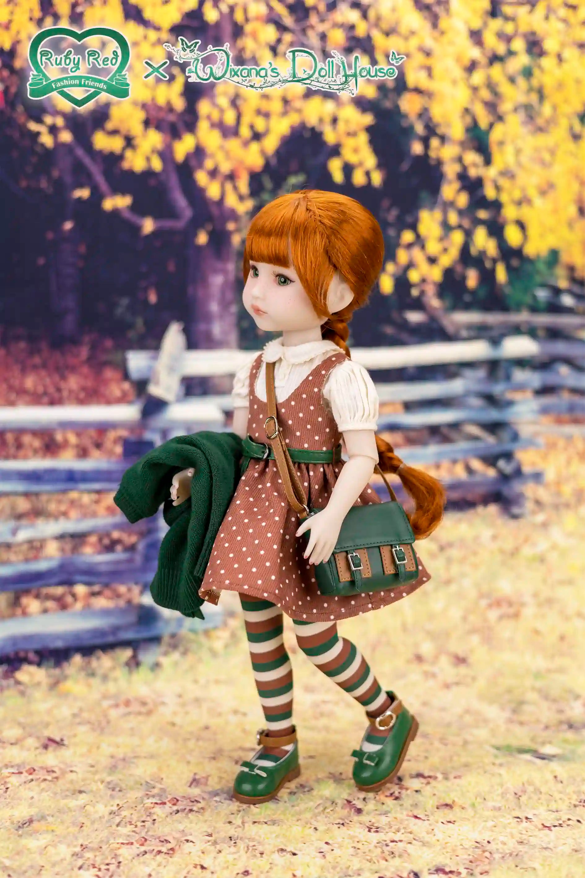 Doll in a brown polka dot dress with suspenders standing in a scenic outdoor setting.