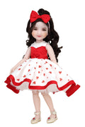Doll wearing a red and white dress with heart patterns on a white background