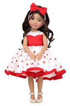 Doll wearing a red and white dress with heart patterns on a white background