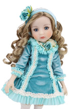 Doll in a blue dress with floral accents on a white background