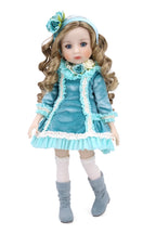 Doll in a blue outfit with a white background