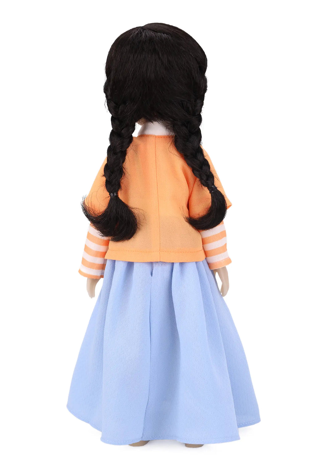 Back view of a doll with braided hair wearing an orange jacket and light blue skirt on a white background