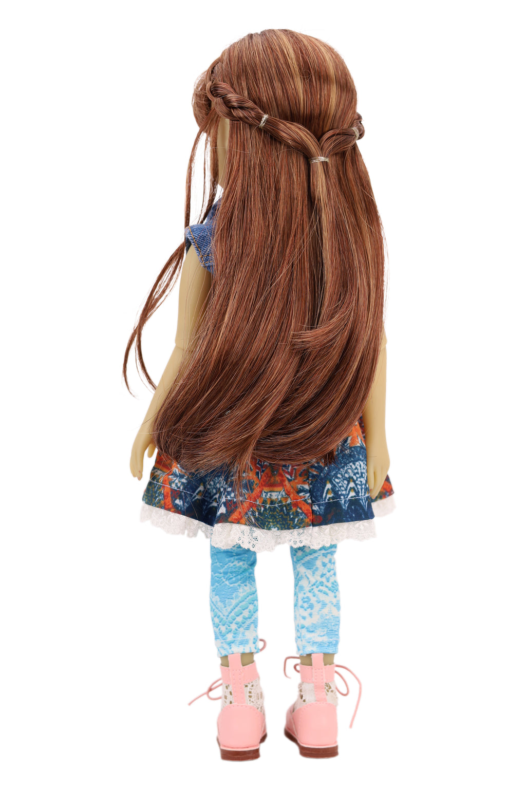 Bella wearing a denim jacket, colorful skirt, and pink shoes on a white background