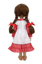 From behind, Jeannette shows her brown braids with red bows, a checkered dress under a white apron, and brown shoes.